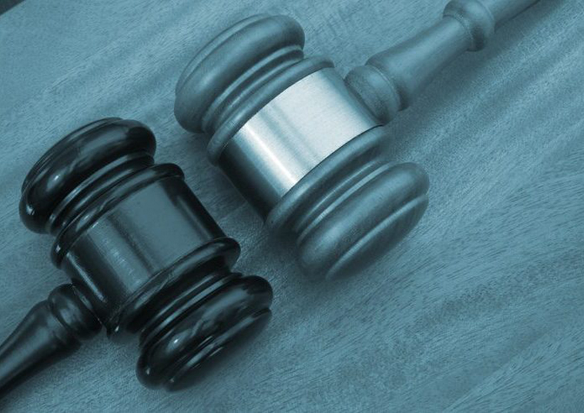 lawsuit two gavels facing each other